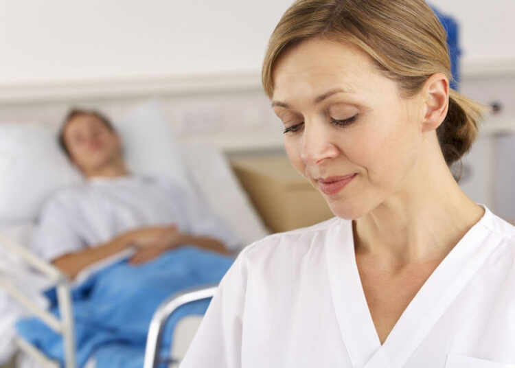 American nurse working on hospital ward